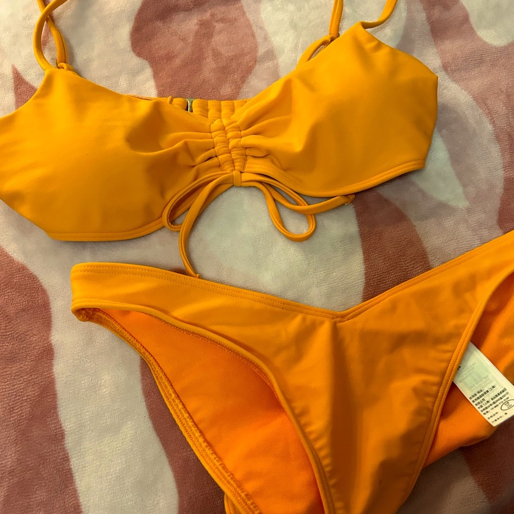 Size s, orange sunset vibe bathing suit.
